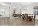 Open-concept living space featuring a dining area, living room and front entry creating an inviting and spacious atmosphere at 14602 Winter Stay Dr, Winter Garden, FL 34787