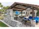 Relaxing lounge area adjacent to the pool with ample seating and shade, perfect for socializing and enjoying the outdoors at 14602 Winter Stay Dr, Winter Garden, FL 34787
