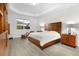 Spacious main bedroom featuring tray ceiling, natural light, and modern décor at 14602 Winter Stay Dr, Winter Garden, FL 34787
