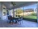 Spacious screened-in patio area, with outdoor dining set, ideal for entertaining at 14602 Winter Stay Dr, Winter Garden, FL 34787