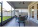 Screened patio featuring a dining table and chairs, providing a comfortable outdoor dining space at 14602 Winter Stay Dr, Winter Garden, FL 34787