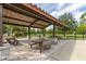 Outdoor picnic area featuring shaded tables and seating, perfect for gatherings and enjoying meals in a serene setting at 14602 Winter Stay Dr, Winter Garden, FL 34787