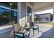 Charming porch featuring comfortable seating, offering a glimpse of the home's attractive exterior and meticulously maintained landscaping at 14602 Winter Stay Dr, Winter Garden, FL 34787