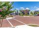 A brick paved view of several retail businesses with trees and parking at 14602 Winter Stay Dr, Winter Garden, FL 34787