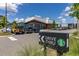 View of Starbucks exterior with drive thru sign, parking lot and manicured lawn at 14602 Winter Stay Dr, Winter Garden, FL 34787