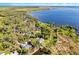 Breathtaking aerial shot of lakefront homes boasting lush surroundings and tranquil water views at 1475 Warrior Trl, Enterprise, FL 32725