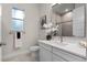 Modern bathroom with white cabinets, vanity, and an attractive shower at 1475 Warrior Trl, Enterprise, FL 32725