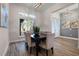 Dining room with large window and elegant decor at 1475 Warrior Trl, Enterprise, FL 32725