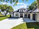 Beautiful new construction featuring a spacious three-car garage and modern architectural design at 1475 Warrior Trl, Enterprise, FL 32725