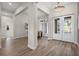 Inviting foyer with elegant lighting, stylish flooring, and views into the dining room at 1475 Warrior Trl, Enterprise, FL 32725