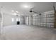 Spacious three car garage with multiple overhead door openers and natural light at 1475 Warrior Trl, Enterprise, FL 32725