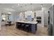 Eat-in kitchen with a large island, pendant lighting, stainless steel appliances, and dining area at 1475 Warrior Trl, Enterprise, FL 32725