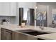 Modern kitchen with stainless steel sink, stylish faucet, and a bright, clean design at 1475 Warrior Trl, Enterprise, FL 32725