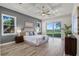 This bright main bedroom offers stunning water views and access to the backyard at 1475 Warrior Trl, Enterprise, FL 32725