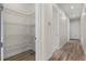 Walk-in pantry with wire shelving and neutral-toned walls and flooring at 1475 Warrior Trl, Enterprise, FL 32725