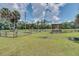 Well-maintained pasture with a gazebo and wooden fencing, creating an idyllic rural setting at 1475 Warrior Trl, Enterprise, FL 32725