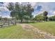 Expansive green pasture enclosed by sturdy wooden fencing, perfect for horses or livestock at 1475 Warrior Trl, Enterprise, FL 32725
