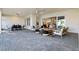 Full view of patio with dining and living areas with sliding door into the home at 1475 Warrior Trl, Enterprise, FL 32725