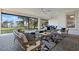 Inviting patio with comfortable seating and views of the lake and lush greenery at 1475 Warrior Trl, Enterprise, FL 32725
