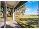 This screened-in patio offers lush green grass with waterfront views at 1475 Warrior Trl, Enterprise, FL 32725