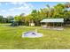 Community recreation area with playground, picnic pavilion, and a fire pit on well-maintained lawn at 1475 Warrior Trl, Enterprise, FL 32725