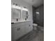 Modern bathroom featuring double sinks, quartz countertop, and a glass-enclosed shower at 15462 Sw 46 Cir, Ocala, FL 34473