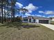 Charming one-story home with a well-maintained lawn, gray roof, and modern design at 15462 Sw 46 Cir, Ocala, FL 34473