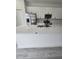 The spacious kitchen island features a quartz countertop and modern faucet at 15462 Sw 46 Cir, Ocala, FL 34473