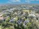 Expansive aerial perspective capturing a charming neighborhood with mature trees and manicured lawns at 1741 Pine Ave, Winter Park, FL 32789