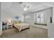 Bright bedroom with comfortable furnishings, decorative pillows, and natural light from the window at 1741 Pine Ave, Winter Park, FL 32789