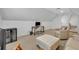Attic bonus room with desk, lounge, wine cooler, and ample space at 1741 Pine Ave, Winter Park, FL 32789