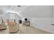 Bright and spacious bonus room with comfortable seating and a desk area at 1741 Pine Ave, Winter Park, FL 32789