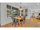 Bright dining area with views of pool and lush outdoor landscaping at 1741 Pine Ave, Winter Park, FL 32789