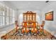 Formal dining room with plantation shutters, classic furniture, and adjacent to the living area at 1741 Pine Ave, Winter Park, FL 32789