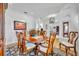 Elegant dining room with dark wood furniture, an ornate rug, and adjacent to the living area at 1741 Pine Ave, Winter Park, FL 32789
