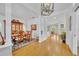 Elegant dining room with hardwood floors and decoratively appointed furniture adjacent to the living area at 1741 Pine Ave, Winter Park, FL 32789