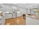 Bright kitchen features stainless steel appliances, granite countertops, and white cabinetry at 1741 Pine Ave, Winter Park, FL 32789