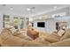 Spacious living room with large built-in shelving, hardwood floors, and comfortable seating arrangement at 1741 Pine Ave, Winter Park, FL 32789