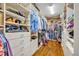 Spacious walk-in closet with custom shelving and ample storage for clothes and accessories at 1741 Pine Ave, Winter Park, FL 32789