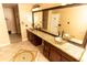 Bathroom featuring double vanity with granite countertop and glass vessel sinks at 1770 Nordic Ct, Apopka, FL 32712