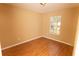 Bedroom with hardwood floors and one window at 1770 Nordic Ct, Apopka, FL 32712