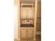 Built-in kitchen cabinet with countertop and decorative tile backsplash at 1770 Nordic Ct, Apopka, FL 32712