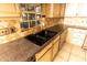 Close-up of the kitchen sink, granite countertops, tile backsplash, and stainless steel faucet at 1770 Nordic Ct, Apopka, FL 32712