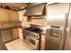 Stainless steel appliances including a professional gas cooktop and refrigerator at 1770 Nordic Ct, Apopka, FL 32712