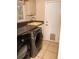 Laundry room with stainless steel washer and dryer and granite countertops at 1770 Nordic Ct, Apopka, FL 32712