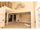 Open-concept living area with tile floors, decorative columns, and seamless flow to the dining area and kitchen at 1770 Nordic Ct, Apopka, FL 32712