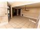 Expansive living area showcasing tile flooring, decorative columns, and seamless connectivity to the kitchen at 1770 Nordic Ct, Apopka, FL 32712