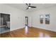 Bedroom with hardwood floors, a ceiling fan, and a bathroom ensuite at 1900 Garvin St, Orlando, FL 32803