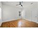 Bright bedroom with hardwood floors, ceiling fan, and a neutral color palette, offering a serene atmosphere at 1900 Garvin St, Orlando, FL 32803