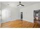 Spacious bedroom with a ceiling fan, hardwood floors and multiple accessways at 1900 Garvin St, Orlando, FL 32803